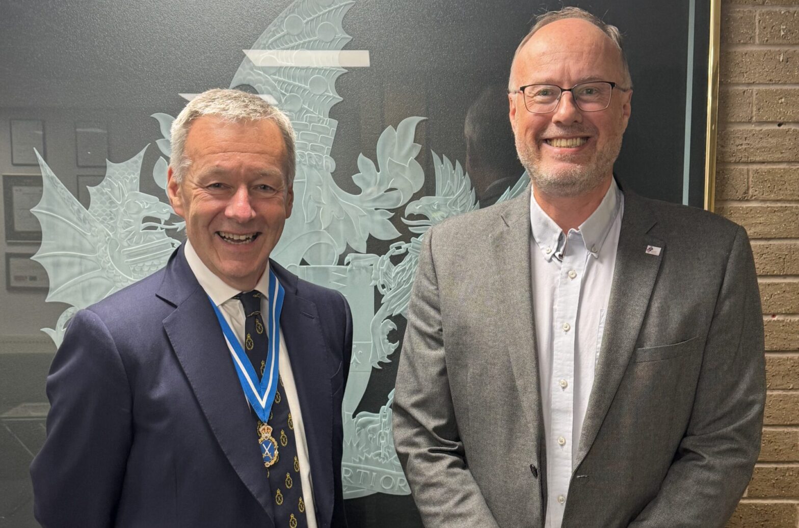Alan Taylor of MiGlass (right) with Mark Smith, the High Sheriff of the West Midlands